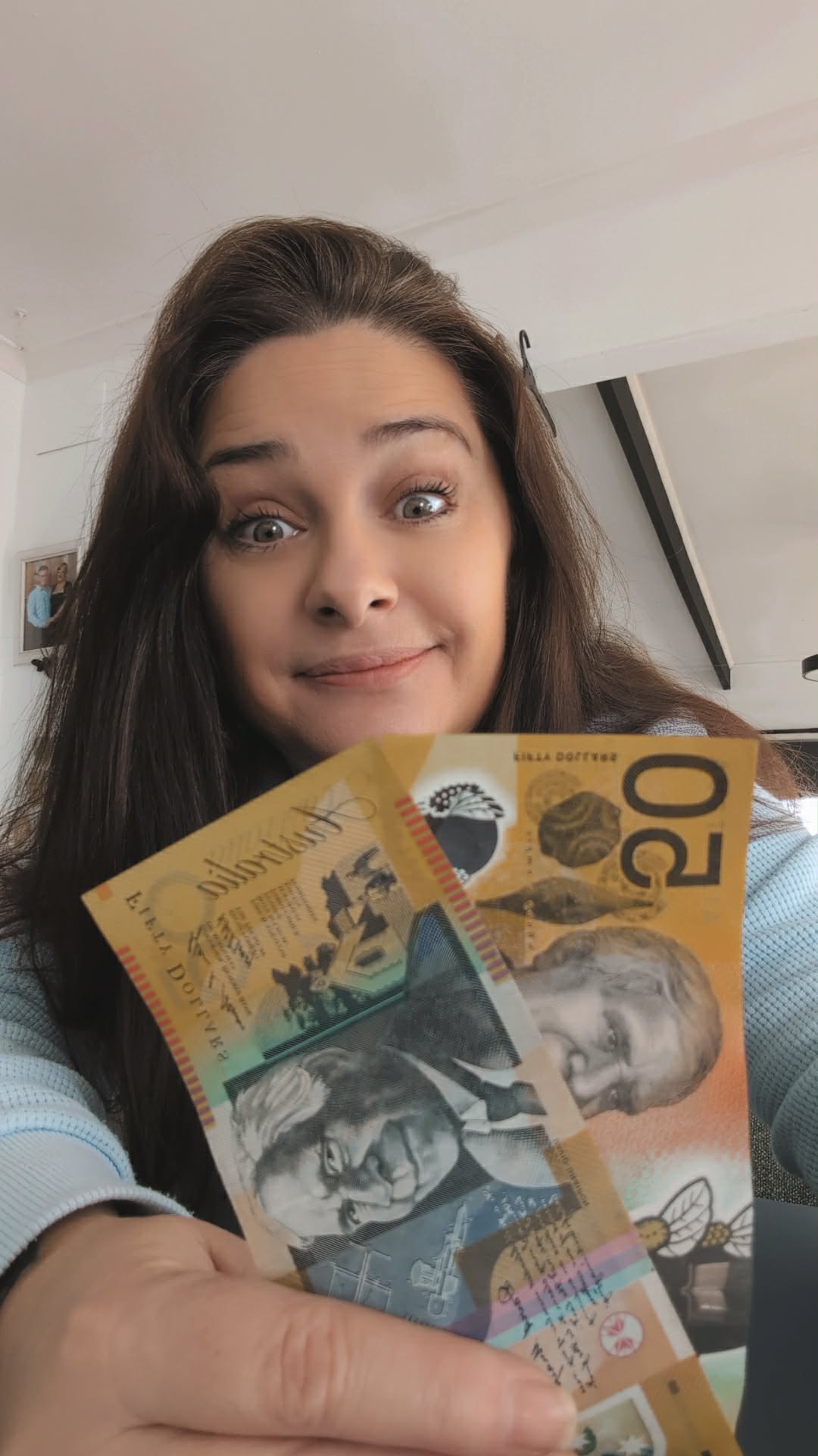 Annalee Mcleod holding her $100 cash prize